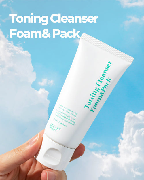 Tube of 'Toning Cleanser Foam & Pack' held against a blue sky with clouds